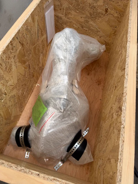 Wrapped nose landing gear in a wooden crate, in a photograph supplied by Patrik